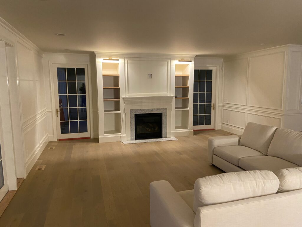 entertainment center with fireplace and cabinet lighting